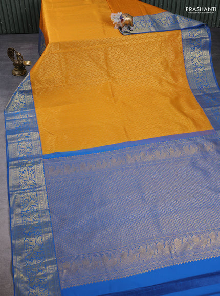 Kanchipuram silk saree mustard yellow and blue with allover zari woven brocade weaves and zari woven border