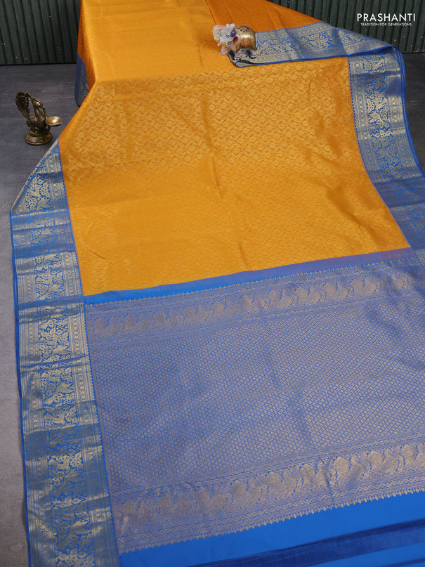 Kanchipuram silk saree mustard yellow and blue with allover zari woven brocade weaves and zari woven border