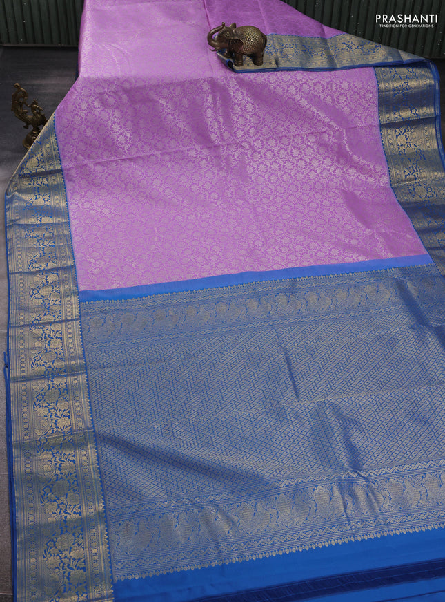 Kanchipuram silk saree lavender and blue with allover zari woven brocade weaves and zari woven border