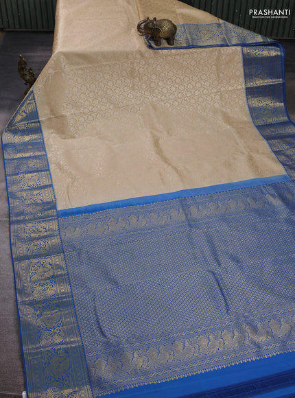 Kanchipuram silk saree beige and blue with allover zari woven brocade weaves and zari woven border