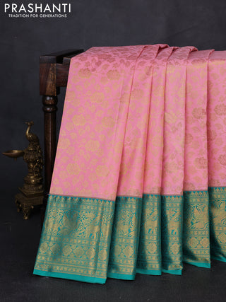 Kanchipuram silk saree light pink and green with allover zari woven brocade weaves and long zari woven border