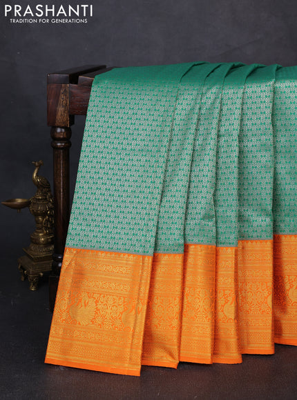 Kanchipuram silk saree green and orange with allover zari woven brocade weaves and long zari woven border