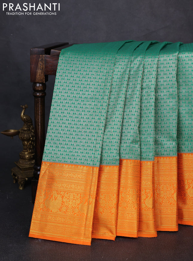 Kanchipuram silk saree green and orange with allover zari woven brocade weaves and long zari woven border