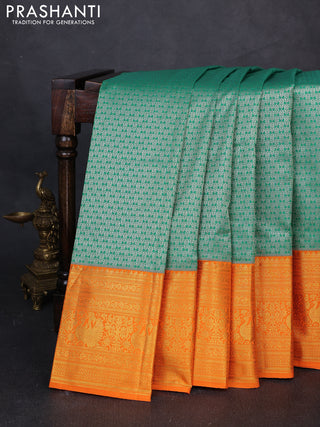 Kanchipuram silk saree green and orange with allover zari woven brocade weaves and long zari woven border