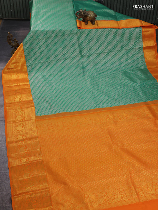Kanchipuram silk saree green and orange with allover zari woven brocade weaves and long zari woven border