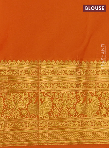 Kanchipuram silk saree green and orange with allover zari woven brocade weaves and long zari woven border