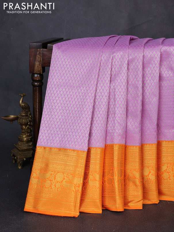 Kanchipuram silk saree lavender and orange with allover zari woven brocade weaves and long zari woven border