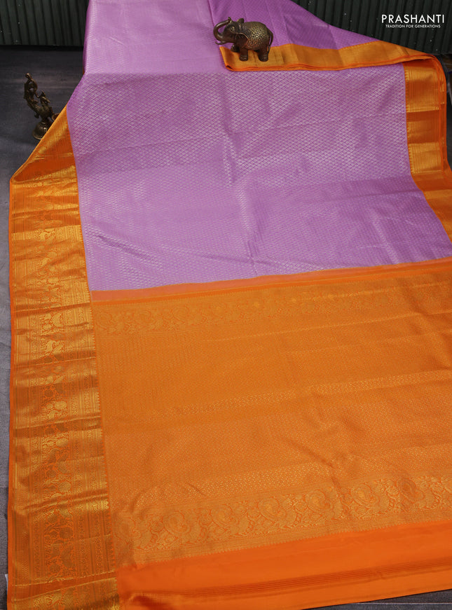 Kanchipuram silk saree lavender and orange with allover zari woven brocade weaves and long zari woven border