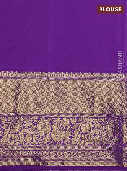 Kanchipuram silk saree light green and purple with allover zari woven brocade weaves and long zari woven border