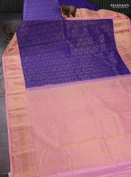 Kanchipuram silk saree blue and peach pink with allover zari woven brocade weaves and zari woven border