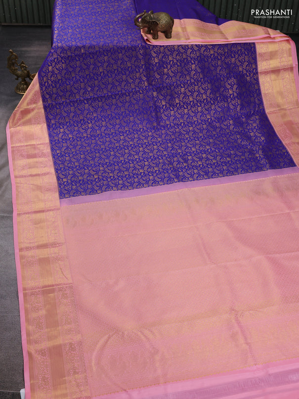 Kanchipuram silk saree blue and peach pink with allover zari woven brocade weaves and zari woven border