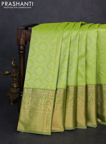 Kanchipuram silk saree light green and elaichi green with allover zari woven brocade weaves and long zari woven border