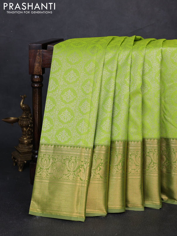 Kanchipuram silk saree light green and elaichi green with allover zari woven brocade weaves and long zari woven border