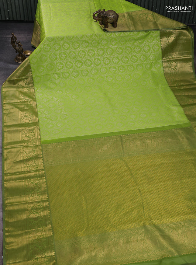 Kanchipuram silk saree light green and elaichi green with allover zari woven brocade weaves and long zari woven border