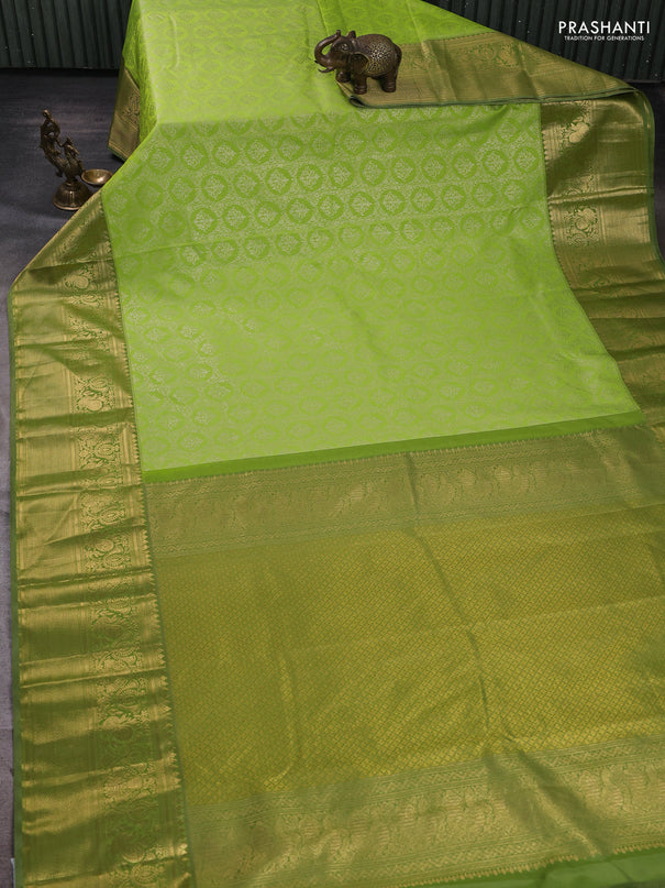 Kanchipuram silk saree light green and elaichi green with allover zari woven brocade weaves and long zari woven border