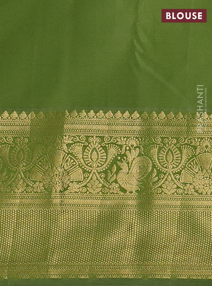 Kanchipuram silk saree light green and elaichi green with allover zari woven brocade weaves and long zari woven border