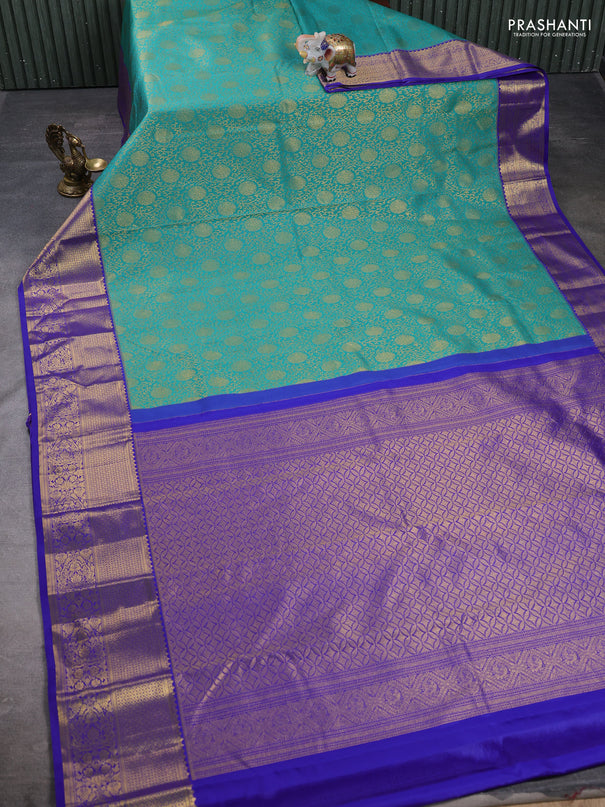 Kanchipuram silk saree teal green and violet with allover zari woven brocade weaves and zari woven border