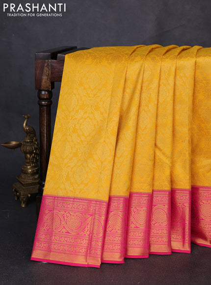 Kanchipuram silk saree yellow and pink with allover zari woven brocade weaves and zari woven border