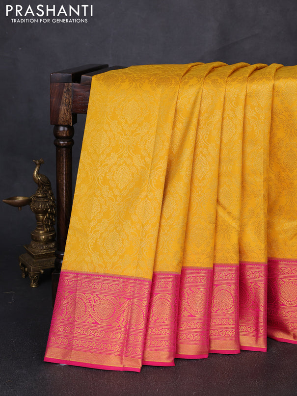 Kanchipuram silk saree yellow and pink with allover zari woven brocade weaves and zari woven border