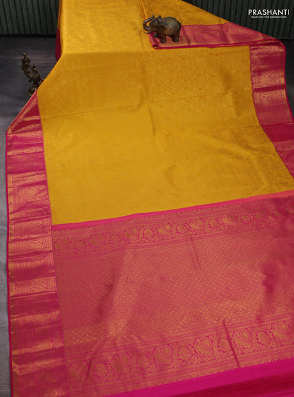 Kanchipuram silk saree yellow and pink with allover zari woven brocade weaves and zari woven border