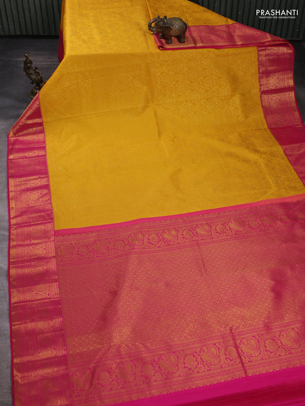 Kanchipuram silk saree yellow and pink with allover zari woven brocade weaves and zari woven border