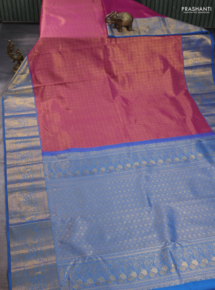 Kanchipuram silk saree magenta pink and blue with allover zari woven brocade weaves and long zari woven border