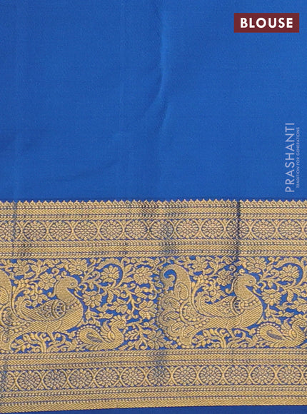 Kanchipuram silk saree magenta pink and blue with allover zari woven brocade weaves and long zari woven border