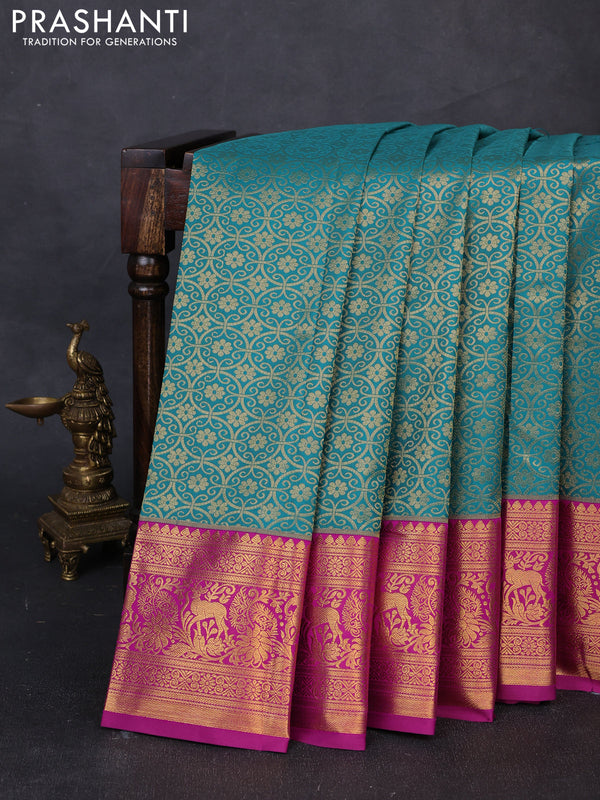 Kanchipuram silk saree teal green and magenta pink with allover zari woven brocade weaves and zari woven border