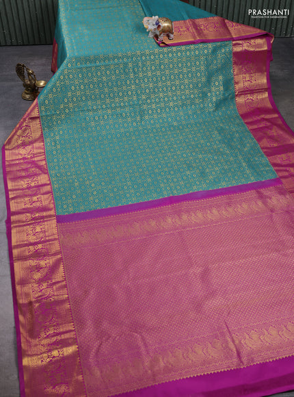 Kanchipuram silk saree teal green and magenta pink with allover zari woven brocade weaves and zari woven border