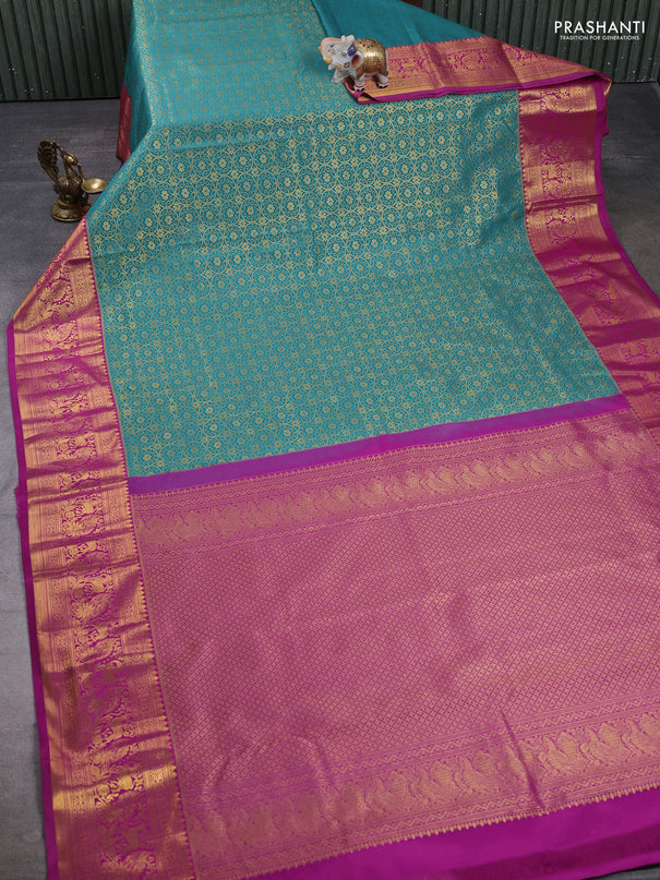 Kanchipuram silk saree teal green and magenta pink with allover zari woven brocade weaves and zari woven border
