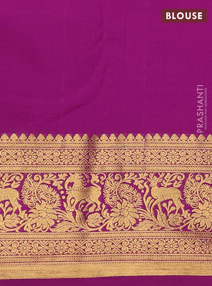 Kanchipuram silk saree teal green and magenta pink with allover zari woven brocade weaves and zari woven border