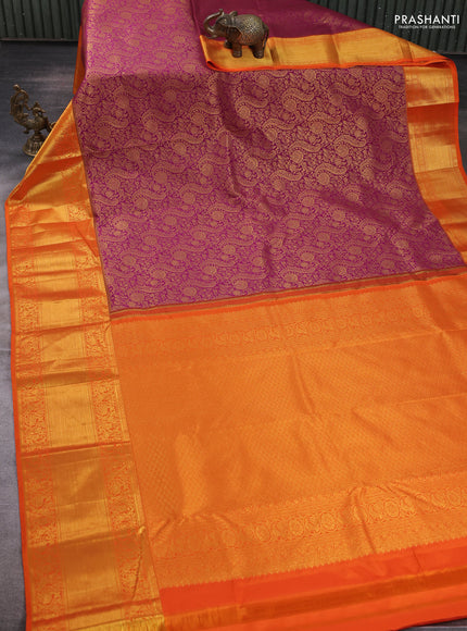 Kanchipuram silk saree dark magenta pink and orange with allover zari woven brocade weaves and long rich zari woven border