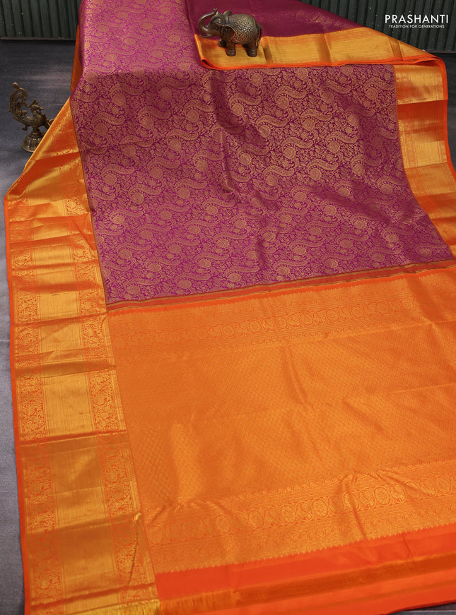 Kanchipuram silk saree dark magenta pink and orange with allover zari woven brocade weaves and long rich zari woven border