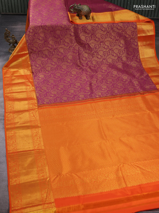 Kanchipuram silk saree dark magenta pink and orange with allover zari woven brocade weaves and long rich zari woven border