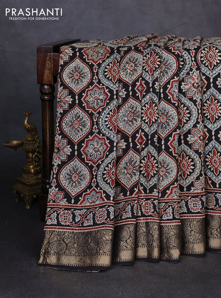 Dola silk saree black and maroon with allover ajrakh prints and zari woven border