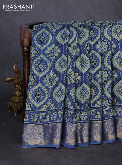 Dola silk saree indigo blue with allover ajrakh prints and zari woven border