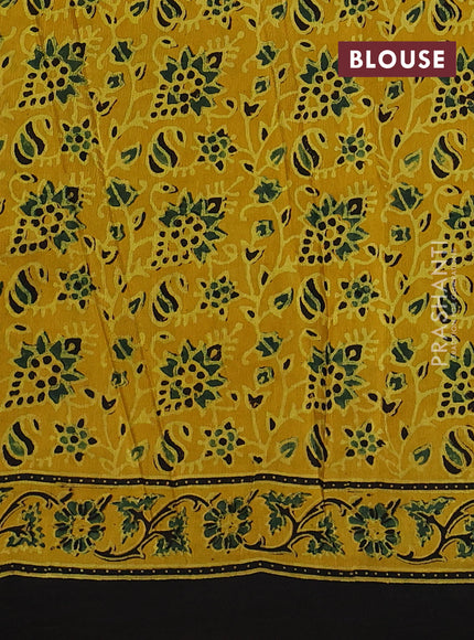 Dola silk saree yellow with allover ajrakh prints and zari woven border