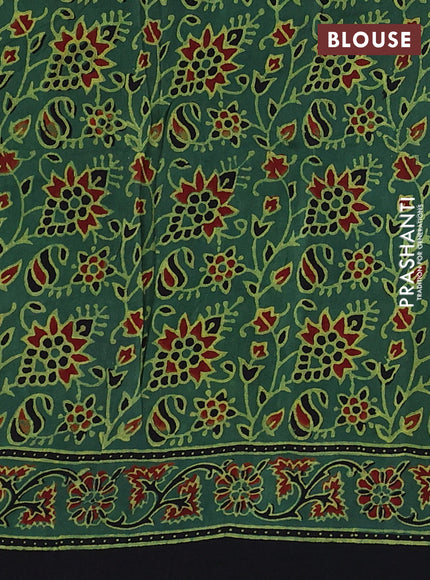 Dola silk saree green shade with allover ajrakh prints and zari woven border