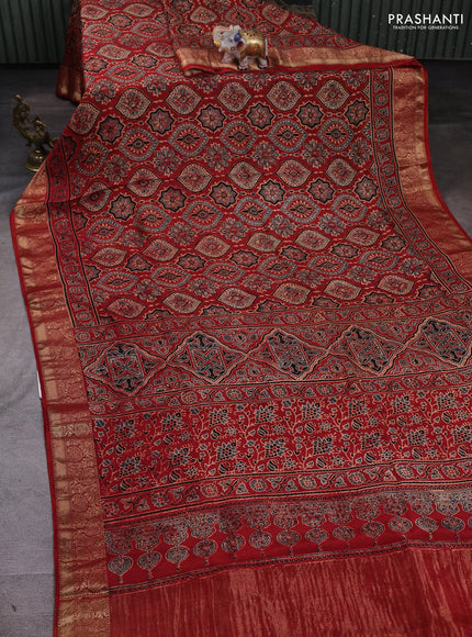 Dola silk saree maroon with allover ajrakh prints and zari woven border