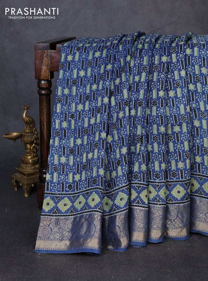 Dola silk saree indigo blue with allover ajrakh prints and zari woven border