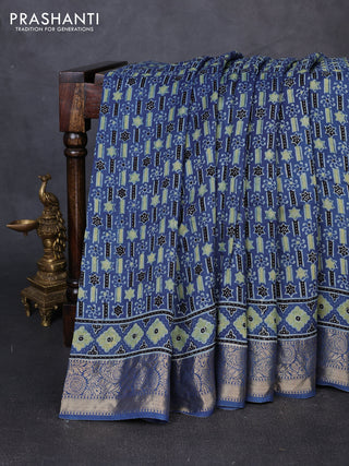 Dola silk saree indigo blue with allover ajrakh prints and zari woven border