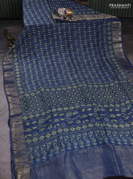 Dola silk saree indigo blue with allover ajrakh prints and zari woven border