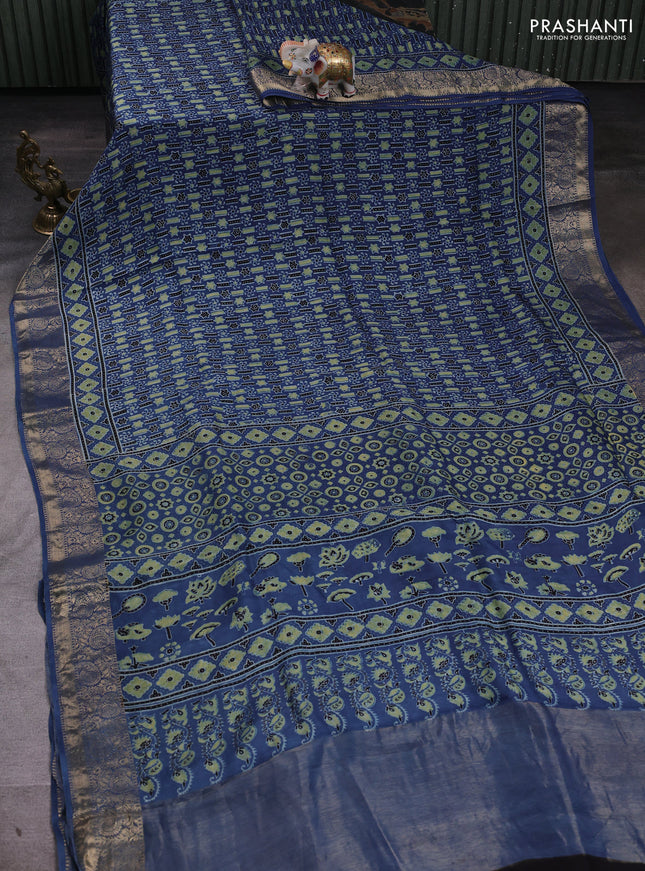 Dola silk saree indigo blue with allover ajrakh prints and zari woven border