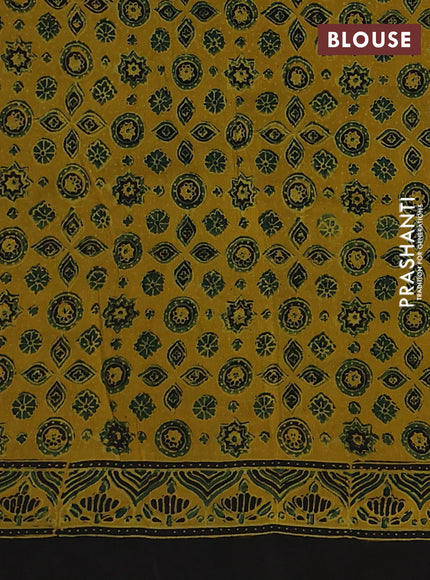Dola silk saree yellow with allover ajrakh prints and zari woven border