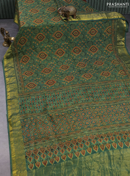 Dola silk saree green shade with allover ajrakh prints and zari woven border