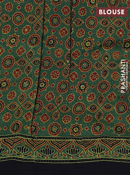 Dola silk saree green shade with allover ajrakh prints and zari woven border