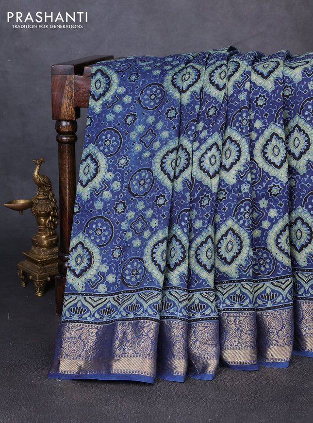 Dola silk saree blue shade with allover ajrakh prints and zari woven border