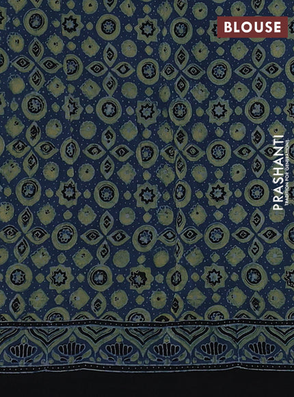 Dola silk saree blue shade with allover ajrakh prints and zari woven border