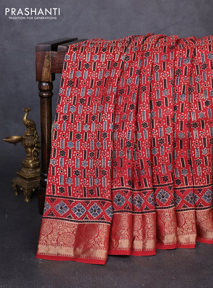 Dola silk saree maroon with allover ajrakh prints and zari woven border