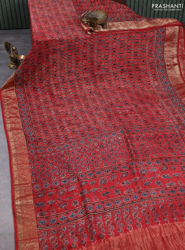 Dola silk saree maroon with allover ajrakh prints and zari woven border